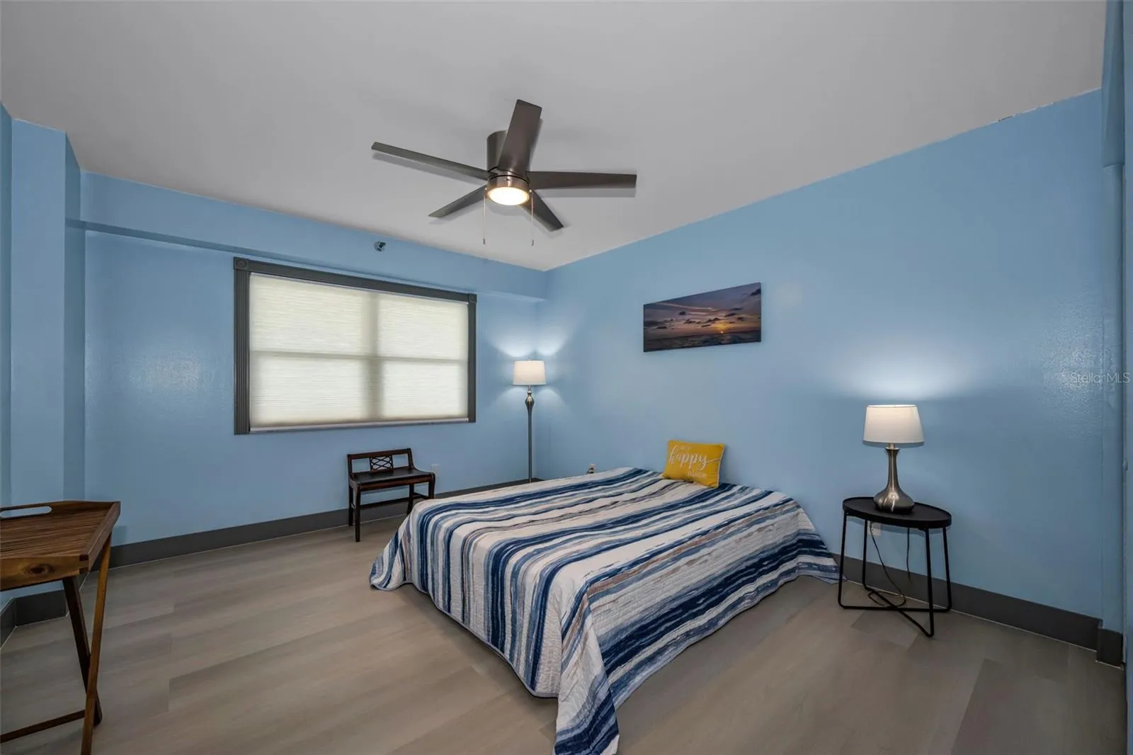 Second bedroom with new fan, luxury randow plank flooring.