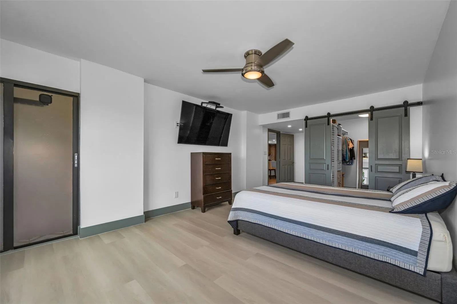 Primary bedroom with special closet sliding doors, and door to Balcony.