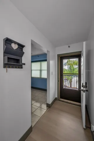 Entrance with bonus room to right.  Luxury random plank flooring throughout.