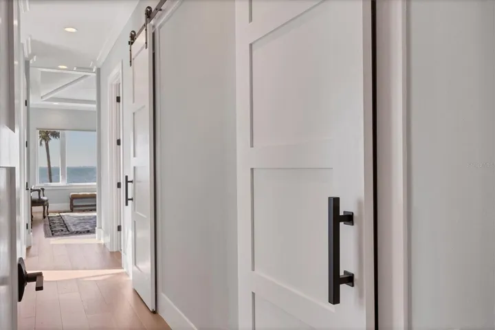 Very Private Primary Hall Featuring Dual His and Her Baths and Walk In Closets
