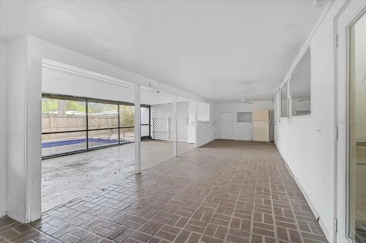 Lanai off pool with a full bathroom and laundry room.