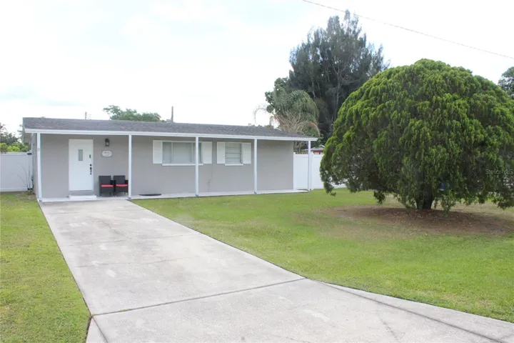 Front of the house, long driveway.