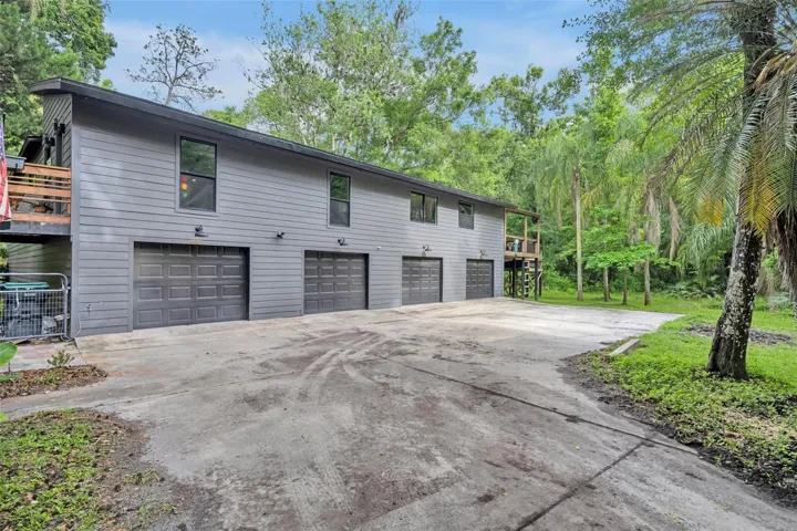 view of 4 garage doors leading to 10 car capacity garage
