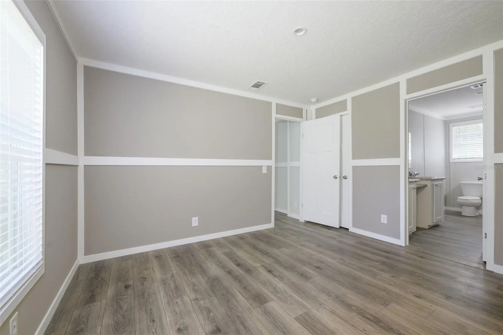 Primary bedroom with walk-in closet, en-suite bathroom