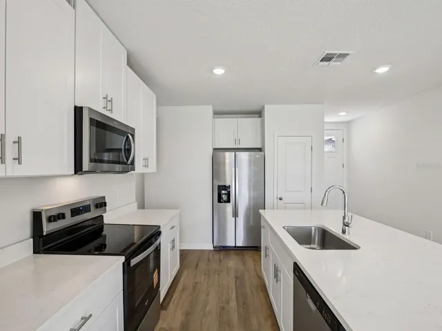 Interior photos are not of the actual home but are photos of the builder home with the same floorplan with similar interior finishes and features.