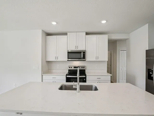 Interior photos are not of the actual home but are photos of the builder home with the same floorplan with similar interior finishes and features.