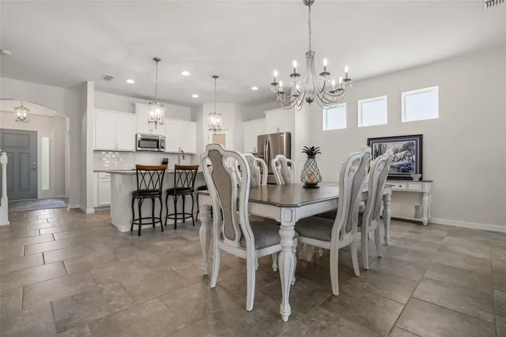 Dining area fits a very large table and has a new chandelier. I also love the fixed windows that add natural light