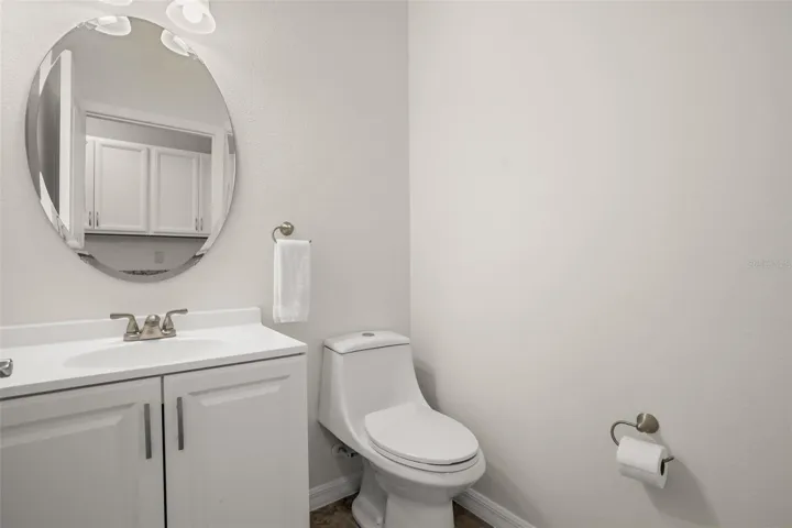 Downstairs half bath with new vanity and light