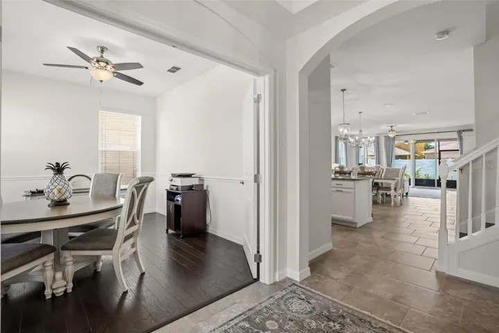 View from front entry of office with solid wood French doors and Great room
