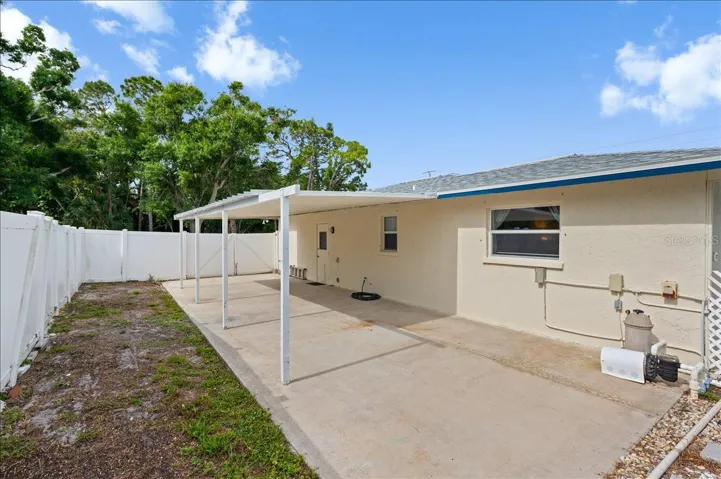 Double gate access to the carport area.