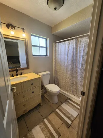 Owner's en-suite bathroom with step-in shower (no tub)