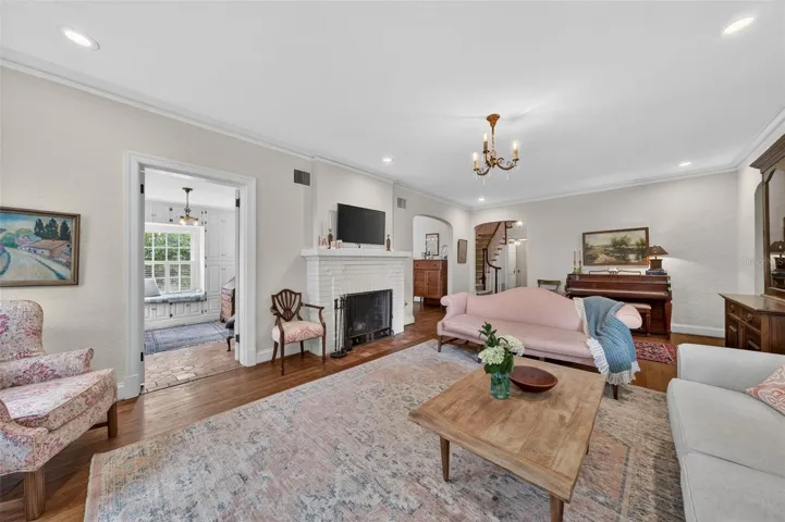 Living room with original masonry fireplace