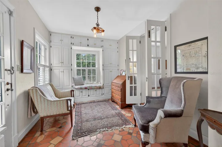 Study off the living room and dining room -original tile floors