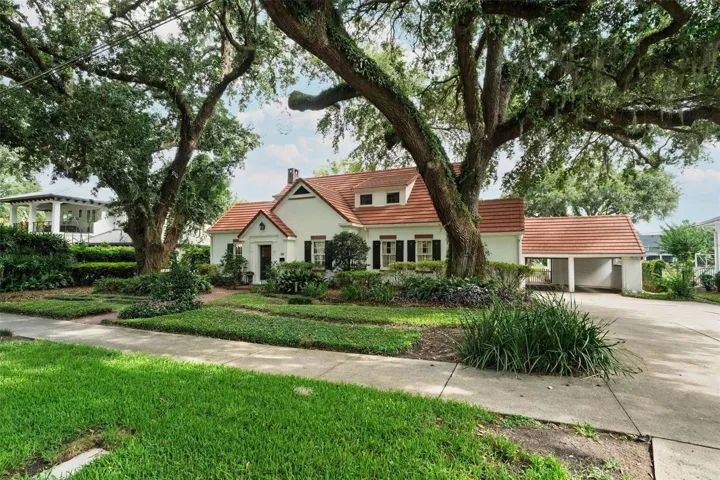 House with the garage doors open.