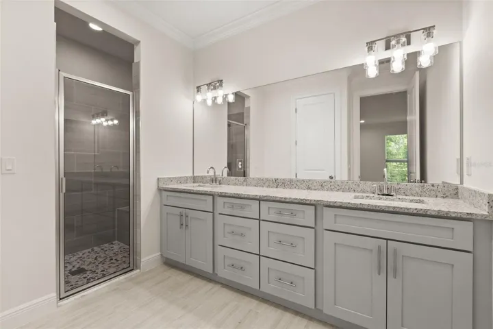 Primary suite bathroom with double vanities