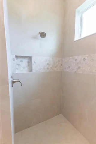 Roman shower in primary bathroom