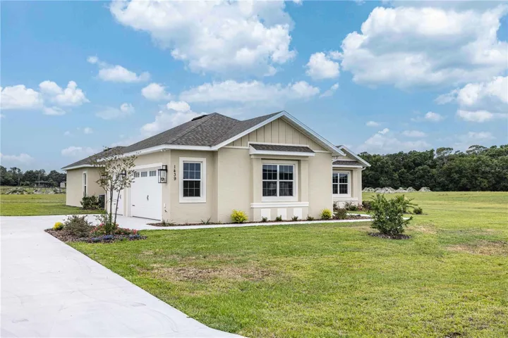 Front view of home with 3 car garage