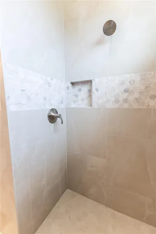 Roman shower in primary bathroom