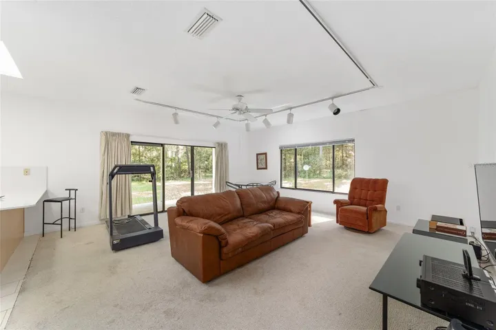 Sliders to a porch that spans the full length of the house