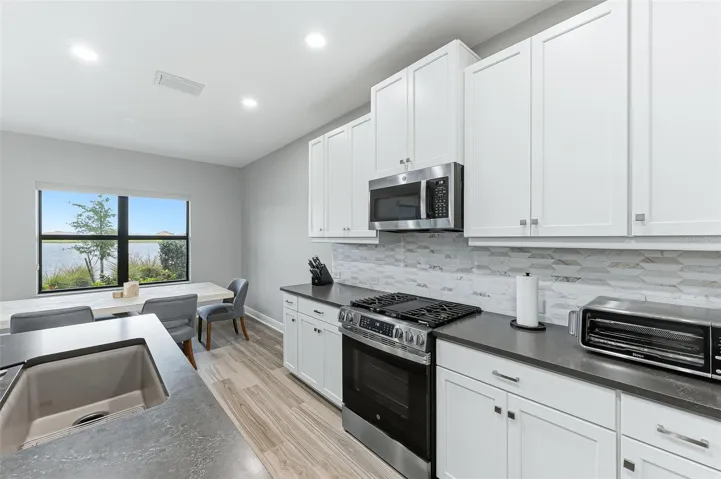 Clean and contemporary lines in expansive kitchen