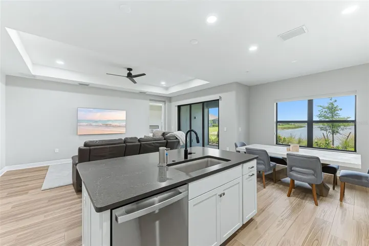 Kitchen, family room, and dining room with tons of natural lighting!