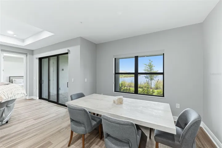 Furnished dining room with water view