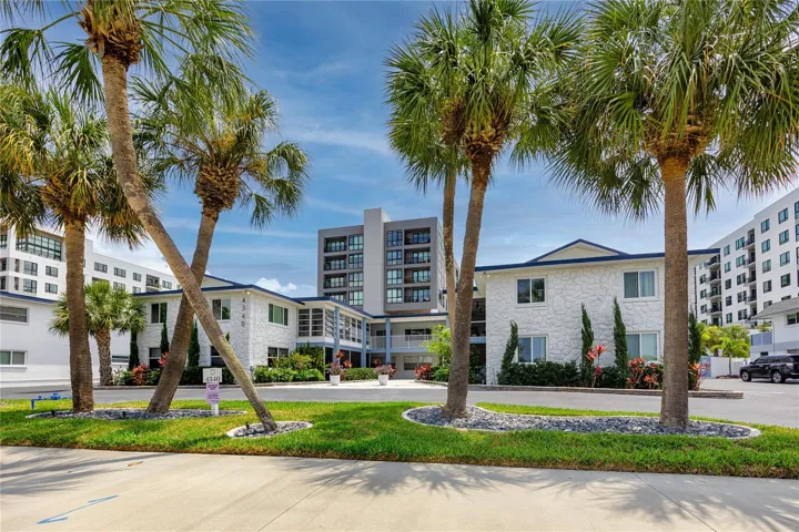 Beautifully maintained 2-level apartment complex with tropical landscaping.