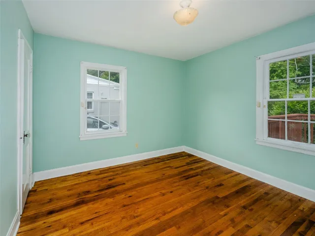Bedroom 2 with view of backyard.