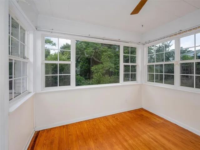 Bright Florida room with view to backyard.