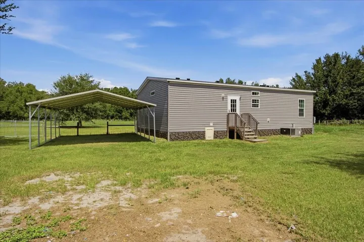 Rear Exterior with Carport
