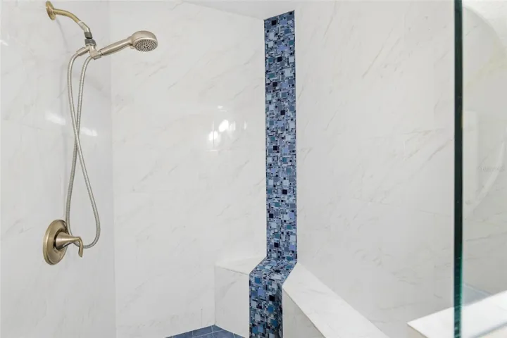 Primary shower, Roman style with built in tile bench