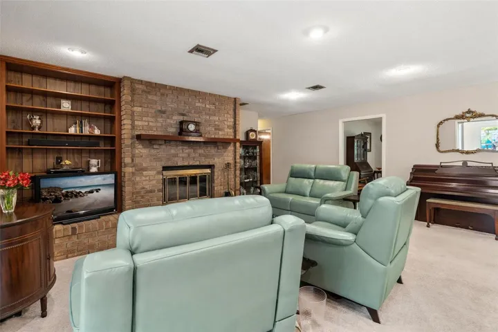 Custom built in shelving by Fireplace.