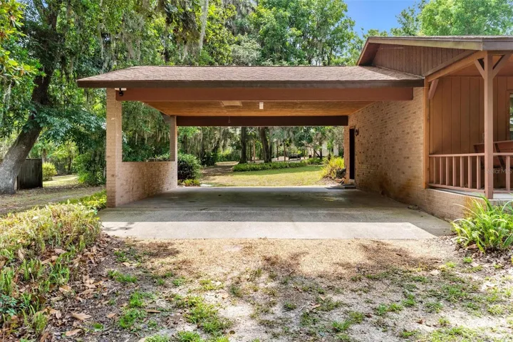 Pass through carport to rear of property...