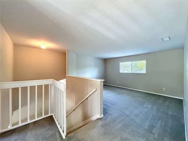 Top of stairs showing the loft area. Close off for another Bedroom?