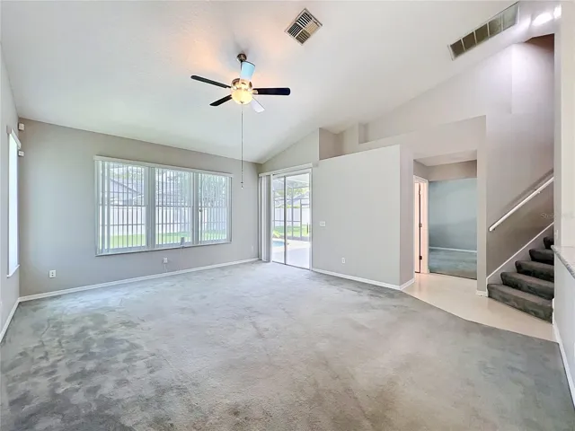 Family Room with access to staircase,pool and half bath access
