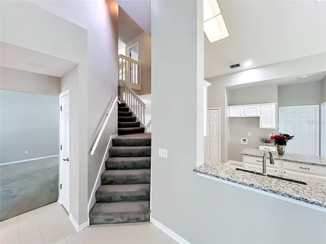 Other side of Staircase from Family Room and Kitchen