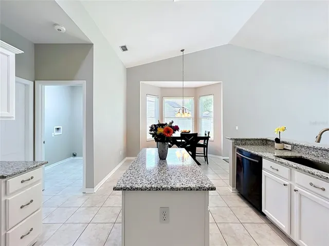 Kitchen with Granite Counter tops, new faucet and freshly painted cabinets. FARM SINK!