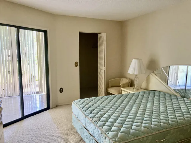 Master bedroom with sliding doors to lanai.