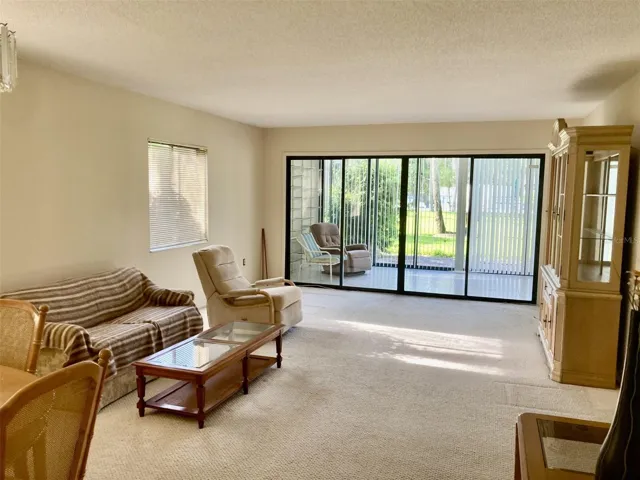 Living room with sliding doors to lanai.