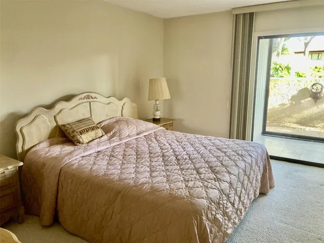 Second bedroom with sliding doors to front porch.