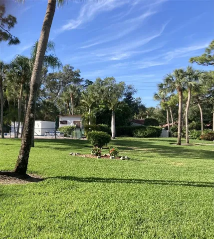 Backyard with short walk to pool.