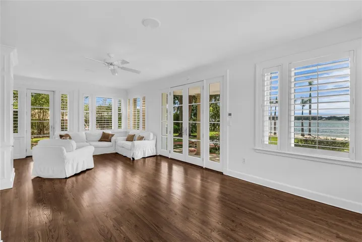 Sunroom with French doors leading to the beautiful backyard