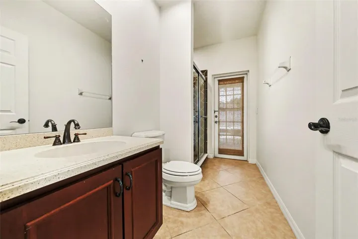 Guest Bath #3 with corian counter sink and walk-in shower. Also, used as pool bath.