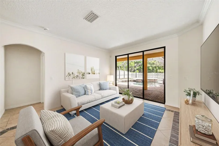 Living room with sliders into lanai area.