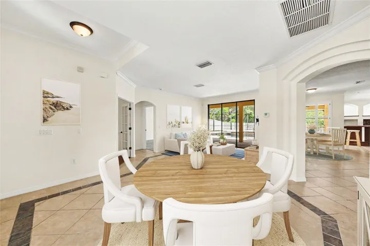 Living Room and Dining room with views of kitchen and family room.