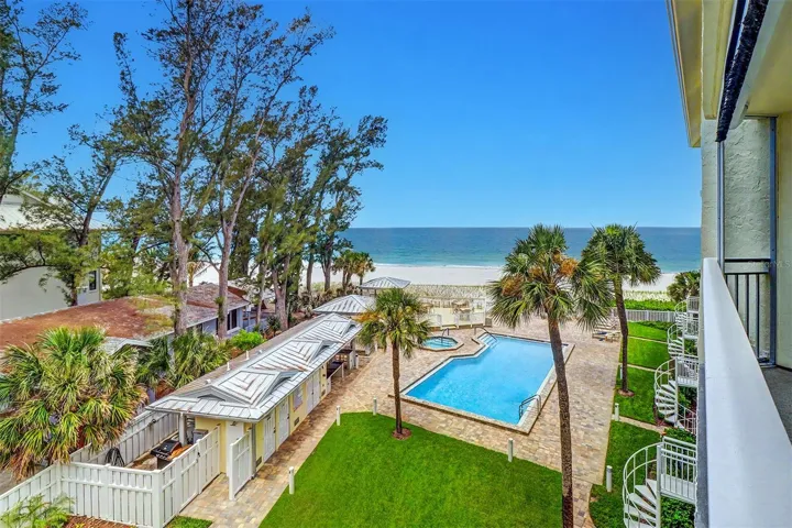 Offering 180 feet of Gulf Beach frontage alongside a rare expanse of beautifully manicured green space.