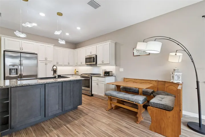 Additional storage cabinetry was added to the island along with a corner shelf to house your cookbooks.