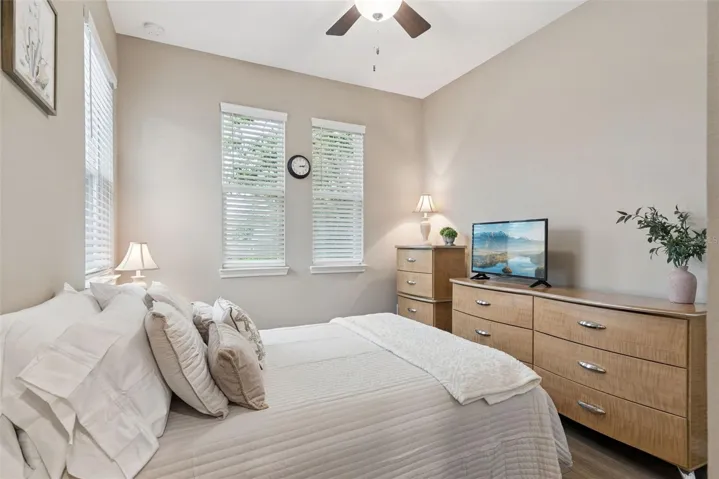 The secondary bedroom and bath, off the foyer, provide a spacious guest retreat and an additional layer of privacy.