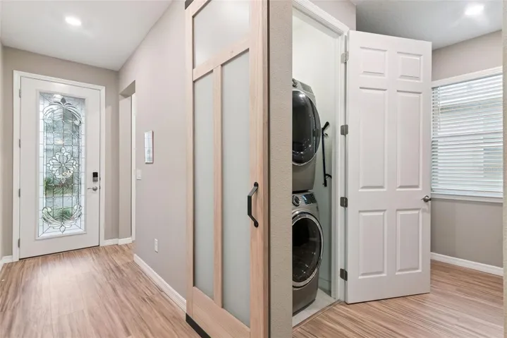 A barn door was added that leads to the now flex/bonus room with laundry closet.