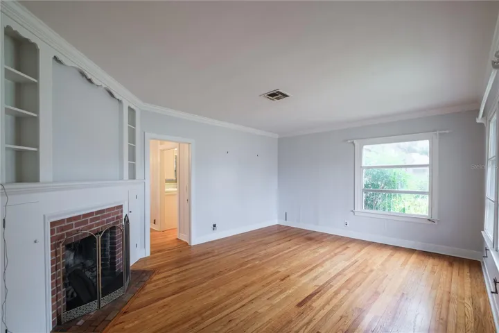 Formal living with classic brick fireplace